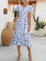 Detail view of a floral print wrap dress featuring a ruffled hem and butterfly sleeves. - S / Dresses / Blue