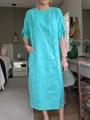 Elegant light blue linen midi dress with round neck and decorative side button details - S / Dresses / Emerald