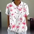 Women's loose white short-sleeved polo shirt featuring a vibrant pink cherry blossom print - S / Tops / White Pink Floral (Pattern 35)
