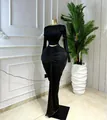 Elegant black two-piece set featuring long-sleeved crop top and ruched maxi skirt - S / Top And Bottom / Black
