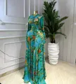 Detail of a form-fitting long-sleeved mesh maxi dress with vibrant abstract tie-dye print - S / Dresses / Green