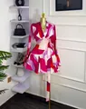 Chic abstract pink print wrap mini dress with long sleeves and waist belt on display - S / Dresses / Rose Red
