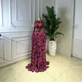Robe longue élégante en maille transparente à manches longues et imprimé fleuri - S / Robes / Rose rouge