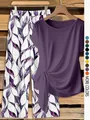 Detail of purple short-sleeve knot top and patterned wide-leg pants coordinates set. - Purple