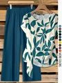 Detail view of women's leaf print short sleeve twist top and matching wide leg pants. - S / Top And Bottom / Aqua