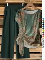 Close-up of vintage floral print pattern and twist knot detail on women's two-piece set. - Army Green