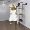 Elegant white sleeveless camisole mini dress featuring detachable 3D floral pin accents - S / Dresses / White