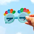 Detail view of light blue birthday party glasses with colorful balloon decorations. - Balloon Style Glasses / Blue
