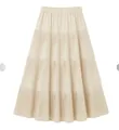 Premium beige tiered pleated knitted A-line midi skirt featuring a comfort elastic waistband - S / Bottoms / Beige Apricot