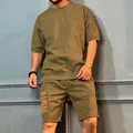 Close-up view of men's olive green cargo sports set with multi-pocket shorts - M / Top And Bottom / Khaki