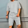 Close-up of men's grey short sleeve t-shirt and multi-pocket cargo shorts set. - M / Top And Bottom / Light Gray