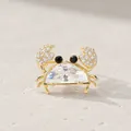 Close-up detail of a cute crab brooch featuring a large clear faceted body stone - White Crystal Crab Brooch / White