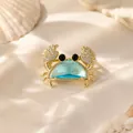 Close-up detail of a summer resort style blue crystal crab brooch with rhinestones - Blue Crystal Crab Brooch / Blue