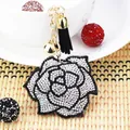 Detailed close-up of a luxury rhinestone rose flower keychain with an elegant black tassel - Black With White Rhinestone