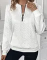 Close-up of white cable-knit quarter-zip sweatshirt with circular ring zipper detail - 3XL / Tops / White (Black Zip)