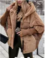 Detail view of a women's camel oversized faux fur and quilted hooded puffer jacket. - S / Tops / Dark Khaki