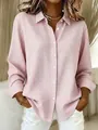 Detail of a pink and white gingham long-sleeved shirt with a classic collar and buttons - Pink