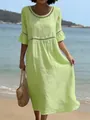 Detalle de un vestido de lino verde lima con encaje calado en una playa mediterránea - S / Vestidos / Verde claro
