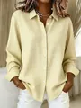 Front view of stylish women's yellow and white gingham long-sleeved shirt with lapels - Yellow