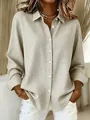 Detailed view of women's beige gingham long sleeve shirt with classic lapel and buttons - Apricot