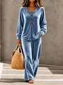 Detail of luxurious blue velvet fabric and wooden buttons on women's casual lounge set - S / Top And Bottom / Sky Blue