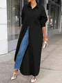 Stylish plus size black long-sleeved shirt tunic worn by a model on a city street - S / Tops / Black