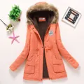 Cozy orange women's winter parka featuring a faux fur hood and soft fleece lining - Orange