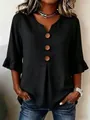 Close-up of black cotton linen blouse with V-neck, large wooden buttons and ruffle sleeves. - S / Tops / Black