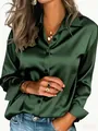 Detailed shot of an elegant glossy emerald green satin long-sleeve women's shirt - Dark Green