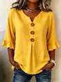 Detail of yellow cotton linen V-neck blouse with large buttons and ruffle sleeves - S / Tops / Yellow