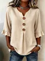 Detailed view of women's beige cotton linen V-neck blouse with large buttons and ruffle sleeves - S / Tops / Light Khaki
