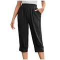 Detail of women's black cotton linen pants featuring elastic waist and large pockets. - S / Bottoms / Black