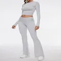 Full view of grey two-piece workout set with long-sleeve crop top and flare pants - XS / Top And Bottom / Light Grey
