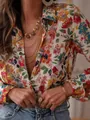 Detail shot of vibrant floral print long-sleeved shirt with chic gold jewelry styling. - S / Tops / French Elegant Floral Print