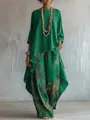 Elegante completo da donna con top verde e pantaloni larghi a fiori coordinati. - Taglia S / Top e Pantaloni / Verde