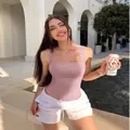 Women's lavender U-neck sleeveless ribbed bodysuit shown in lifestyle outdoor shot - S / Tops / Lotus Pink