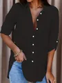 Close-up detail of a minimalist black oversized button-down blouse with long sleeves - S / Tops / Black