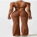 Brown slim-fit yoga jumpsuit featuring a backless cutout design and stylish flared legs - Light Coffee