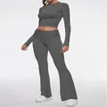Full view of women's grey two-piece set featuring a crop top and flared leggings - XS / Top And Bottom / Dark Heather Gray