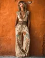 Detailed view of boho-style cream jumpsuit with vibrant ethnic floral print and wide legs. - S / Set / Apricot