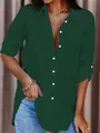 Detailed view of women's emerald green button-down blouse with rolled-up sleeves - S / Tops / Dark Green