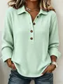 Dettaglio del top verde menta in maglia a nido d'ape con colletto polo e bottoni - Taglia S / Top / Verde chiaro