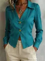 Detail shot of a teal long-sleeve blouse with stylish V-neck and golden decorative buttons. - S / Tops / Teal