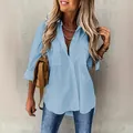 Detail view of a light blue long-sleeved button-down shirt featuring functional chest pockets - Light Blue