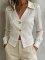 Detail view of a professional off-white long-sleeved blouse with elegant gold buttons. - S / Tops / White