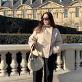 Detailed view of a chic beige double-breasted short coat styled with a matching bag. - XS / Tops / Apricot Double Breasted