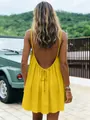 Detailed back view of a vibrant yellow backless slip mini dress for beach vacation. - S / Dresses / Yellow