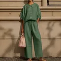 Full view of women's sage green linen set with puff sleeve shirt and drawstring pants - Green