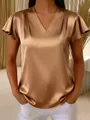 Close-up of elegant champagne satin V-neck blouse featuring sophisticated pleated flutter sleeves - S / Tops / Khaki