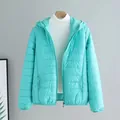 Lightweight hooded puffer jacket for women in vibrant cyan color - Lake Blue